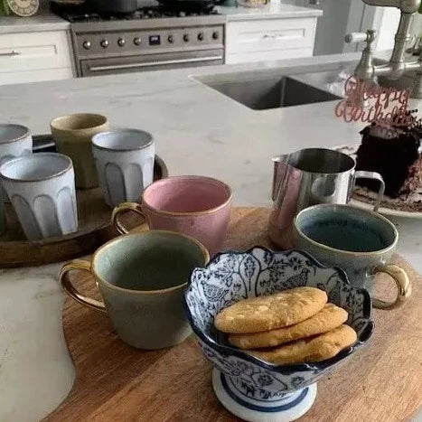 Ariel coffee mugs on board with cookies