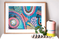 Thumbnail for A framed 1000 Piece Puzzle - Day Tripper print from Journey of Something on a table next to a potted plant.