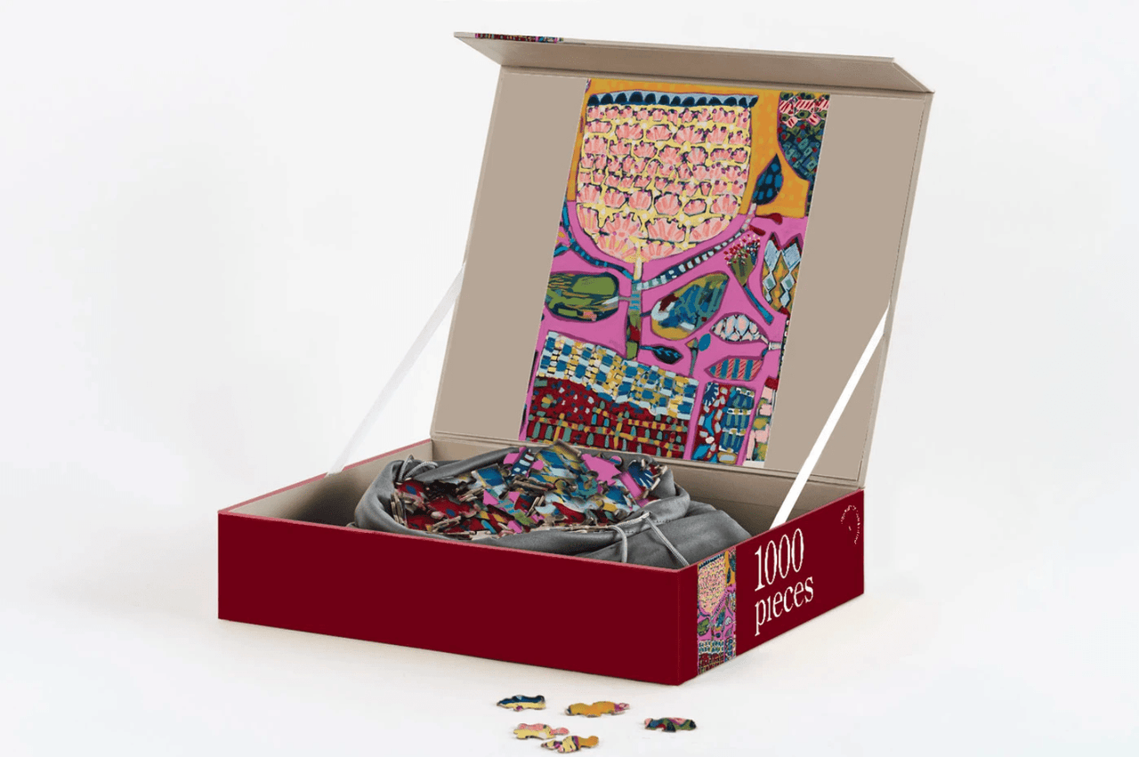 A box with a 1000 Piece Puzzle - Mexicana by Journey of Something in it.