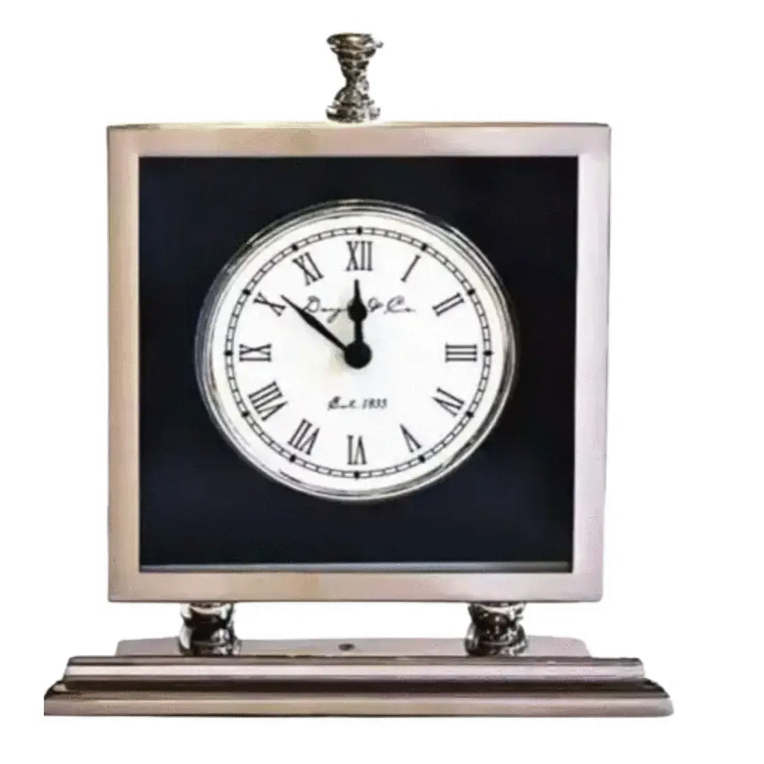 A Nickel and Black Mantel Clock with roman numerals on a stand. The brand name is Flair Gifts.