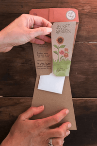 Thumbnail for A person opening an envelope with Seeds - Secret Garden from Sow n Sow.