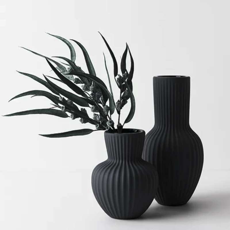 Two Annix Tall Vases - Black by Floral Interiors on a white surface.