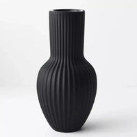 Thumbnail for An Annix Tall Vase - Black by Floral Interiors on a white surface.