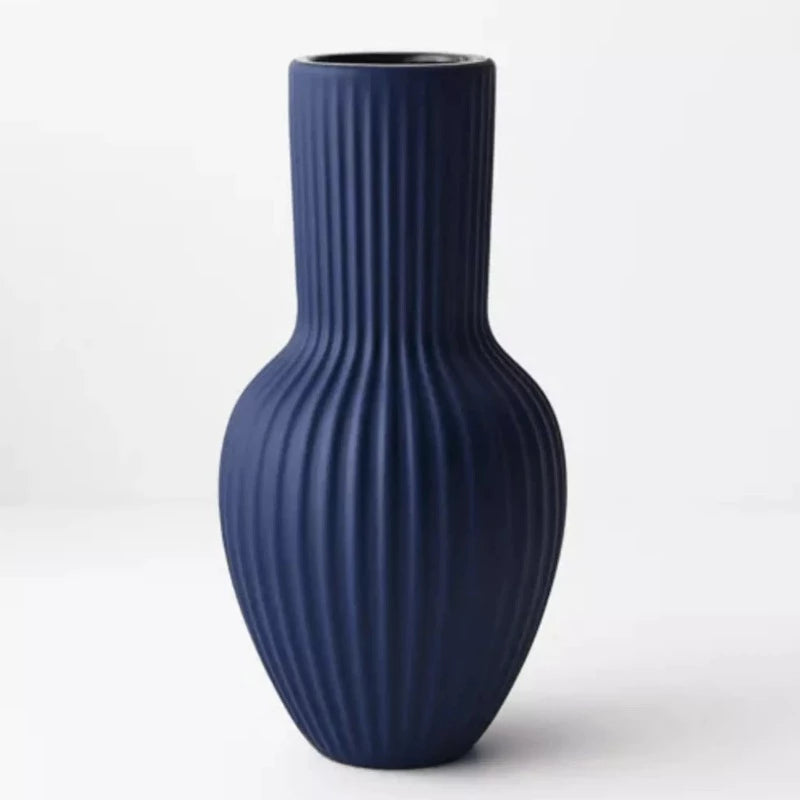 A Floral Interiors Annix Tall Vase - Cobalt on a white background.