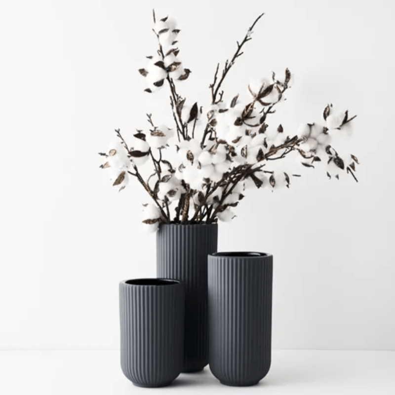 Set three annix vases in steel with white floral arrangement