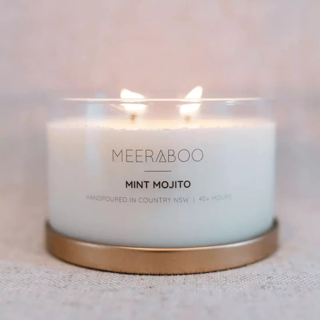 A Meeraboo Soy Candle - Mint Mojito with the words meraboo mint latte on it.