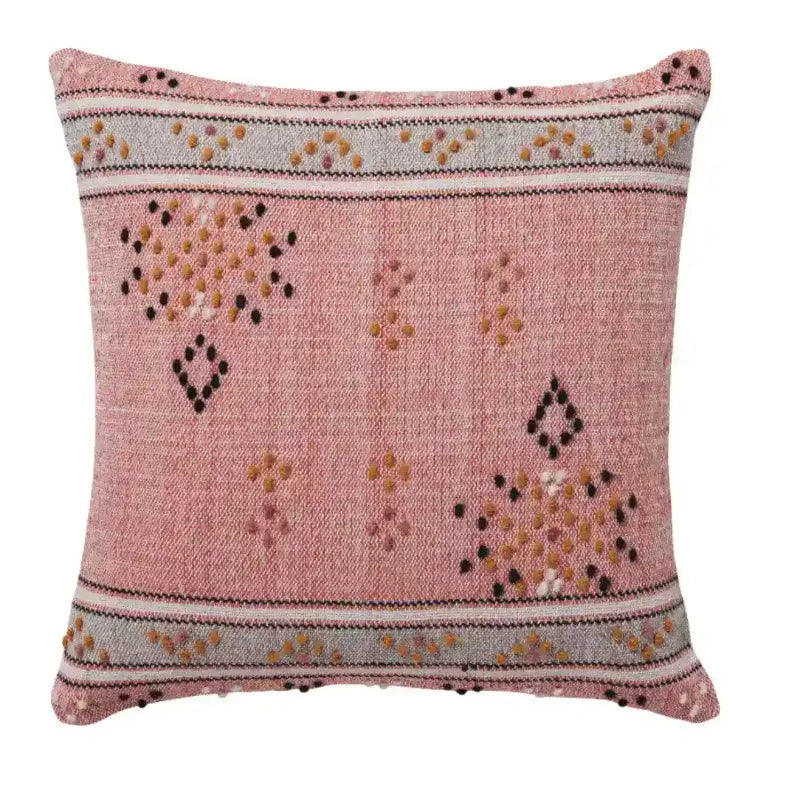 A Mya Cushion by L&M Home with a geometric pattern.