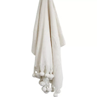 Thumbnail for A LaVida white throw rug - Snow Pompom with pom poms hanging on it.