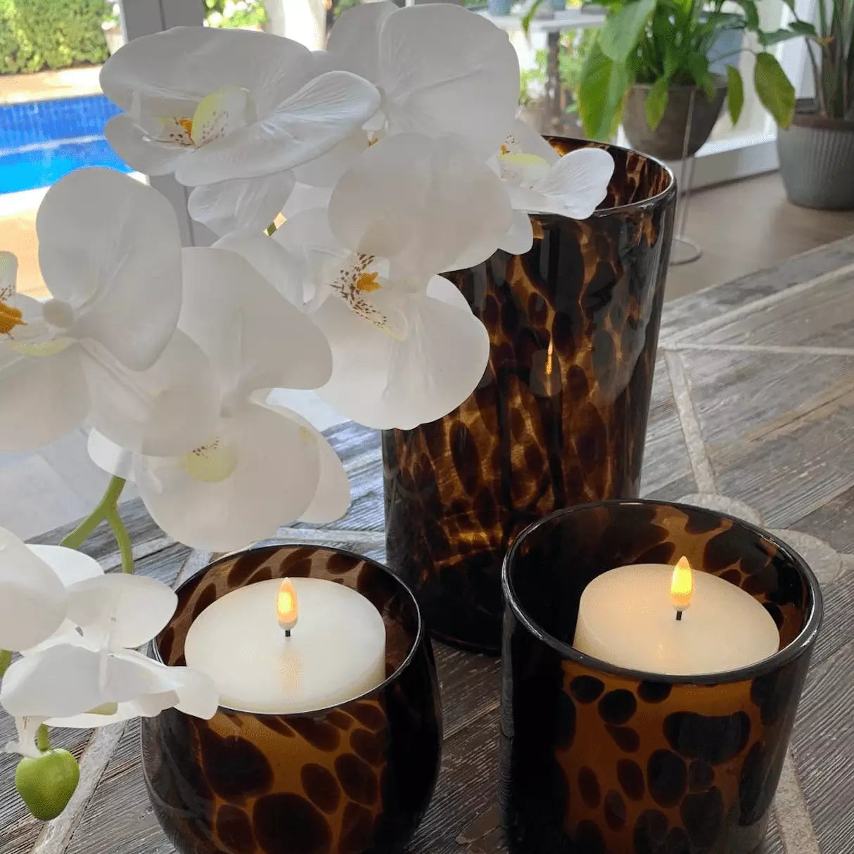 Three Tortoiseshell Vase - Large with candles and orchids on a table from Mediterranean Markets.