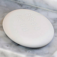 Thumbnail for A white marble soap dish with a Enjoy Living Flameless Candle Luxury Remote on it.