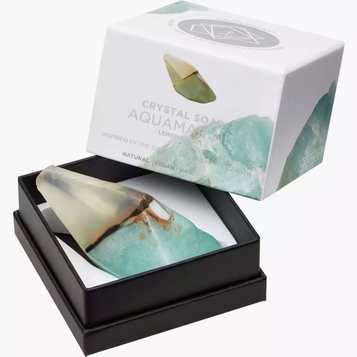 This elegant Summer Salt Body crystal soap comes in a luxurious box, showcasing its beautiful Aquamarine stone. Dive into the soothing world of this Crystal Soap - AQUAMARINE - Lemongrass and experience the refreshing touch of aqua.