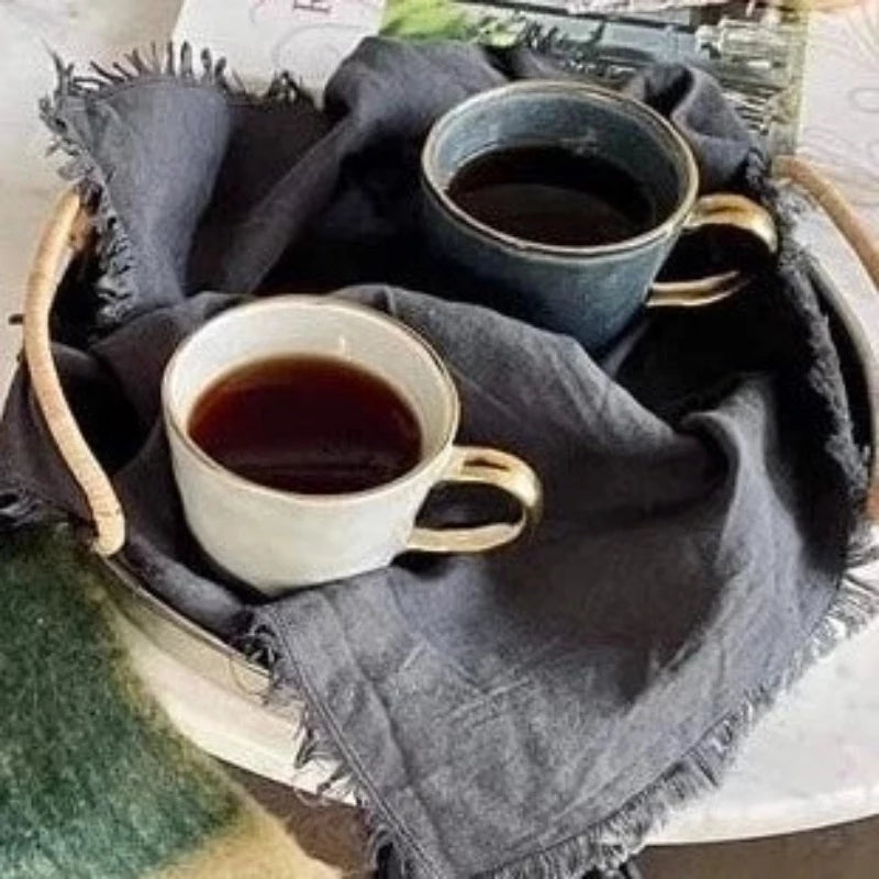 Ariel coffee mugs on a tray with coffee