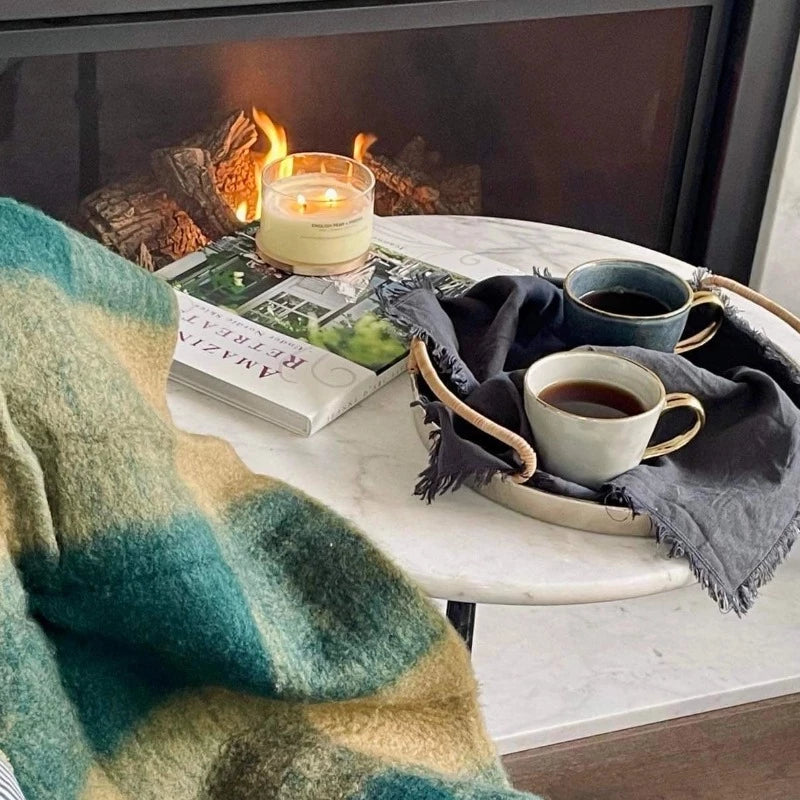 Ariel mug in deep blue and french grey on a tray next to fireplace with coffee and a candle