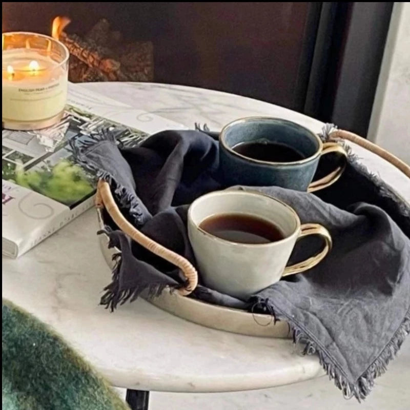 Ariel mug in French grey with coffee sitting on a tray near the fire