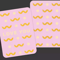 Thumbnail for Two bright pink Collective Hub Kindness Cards with the words love you on them.