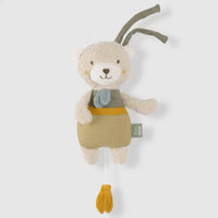Thumbnail for The FehnNATUR Mini Musical Bear by Pilbeam features soft beige fur, a green and mustard outfit, a blue scarf, and two fabric loops on its head. A yellow pull cord hangs below. Ideal as a sleeping aid. Presented against a plain white background.