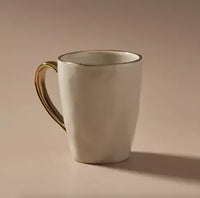 Thumbnail for An Indigo Love Senseo Mug - French Grey with gold trim on a beige background.