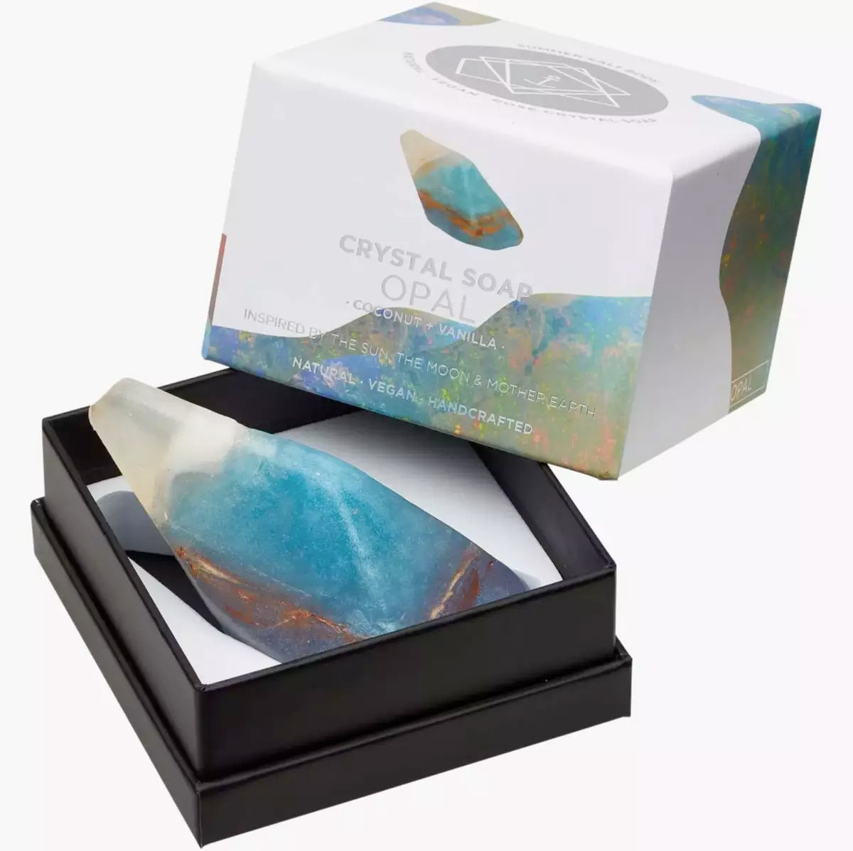 A box with a blue and white Summer Salt Body Crystal Soap - OPAL - Coconut + Vanilla in it, containing a beautiful opal stone.