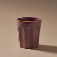 Thumbnail for A small Indigo Love Ritual Latte Cup sitting on a beige surface.