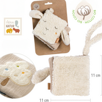 Thumbnail for The Pilbeam FehnNATTUR Soft Book Sheep is a plush, cream-colored sensory activity toy shaped like a sheep with floppy ears and embroidered details. Made from organic cotton, it measures 11x11 cm and features an embroidered tree and eco-friendly Bio Cotton label.