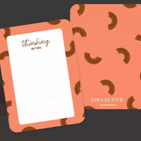 Thumbnail for A bright pink and brown Kindness Cards notepad with the words thinking about you by Collective Hub.
